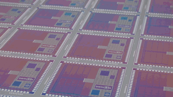 The hero loop: the camera pushes into one chip on a silicon wafer, with the Intrinsic logo etched in its metal